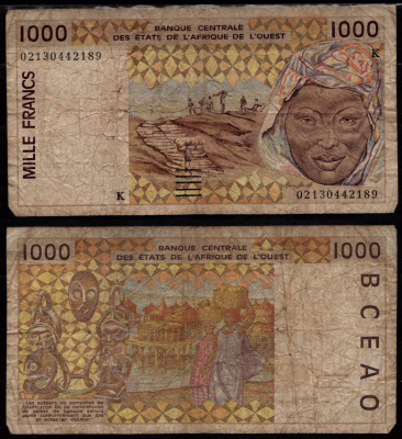 Кот-д'Ивуар 1000 франков 2003 Перевозка арахиса, Женщина, на обратной стороне: женщины, контейнеры для хранения вещей на берегу реки. Pick 111 Al бумага 7523-10-4-1